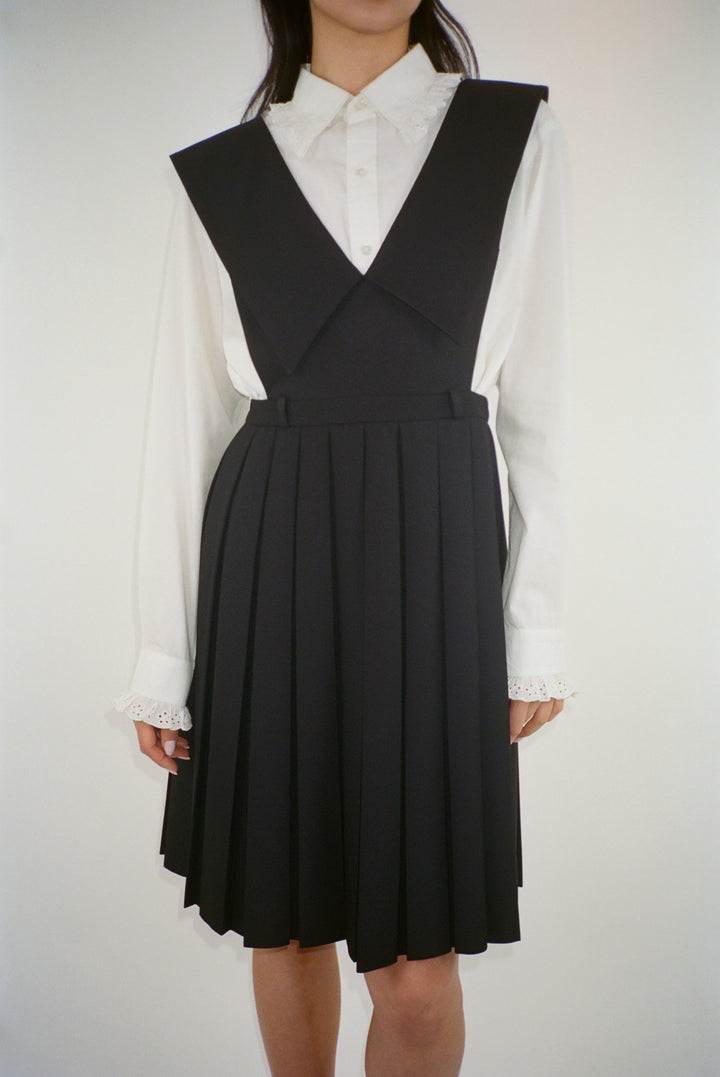 Knee length pinafore dress in black