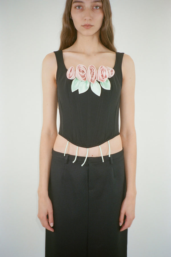 Structured corset in black with pink roses at front