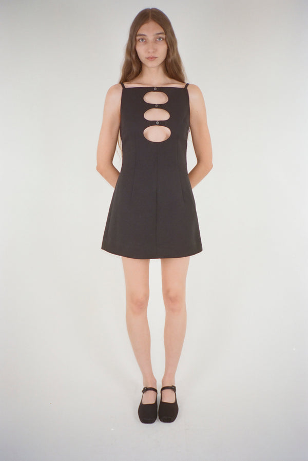 Mini dress in black suiting fabric with cutouts