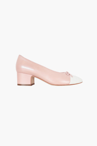 pink block heel shoe with white toe cap