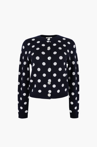 Black cardigan with white polka dots on a white background