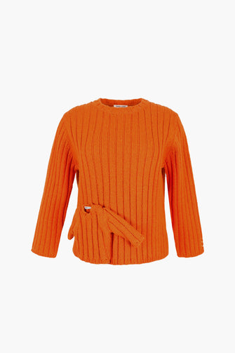 Orange ribbed sweater with a belt on a white background