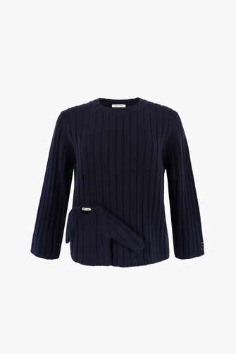 Navy blue ribbed sweater with a mini sweater tacked on front on a white background