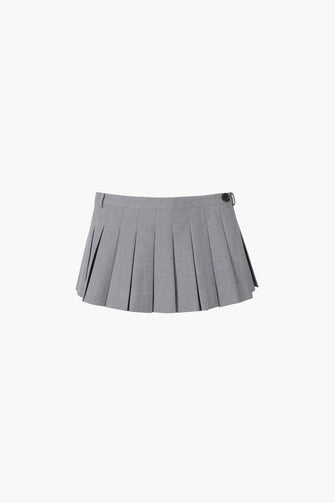 A pleated micro skort in grey with built-in shorts and a button closure at the side, presented on a plain background.