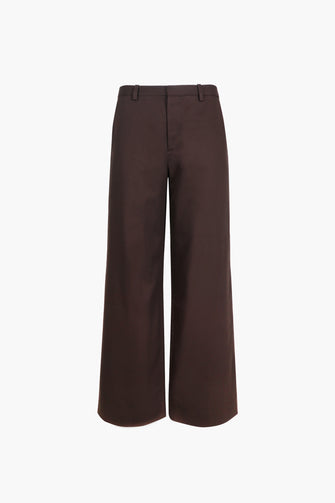 A pair of brown full-length cotton trousers with a wide-leg fit and low waist design on a white background.