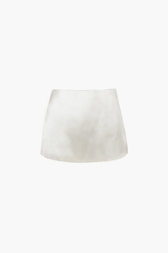 A mini skirt in champagne color with a concealed side zipper, displayed against a plain background.