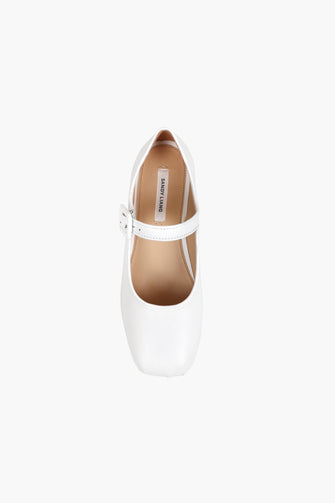 A single white Mary Jane pointed-toe flat shoe made of Nappa leather, featuring an adjustable pin-buckle strap and a padded leather footbed against a white background