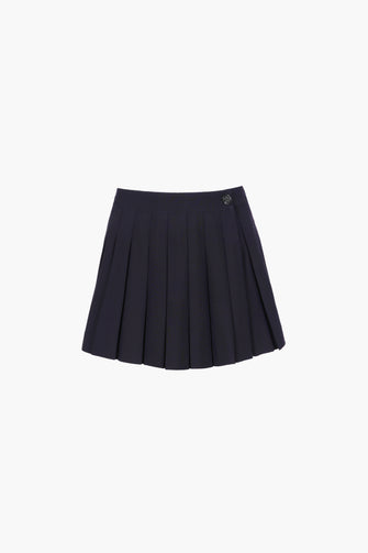 A pleated mini skort in dark navy with built-in shorts underneath, fully lined, on a plain background.