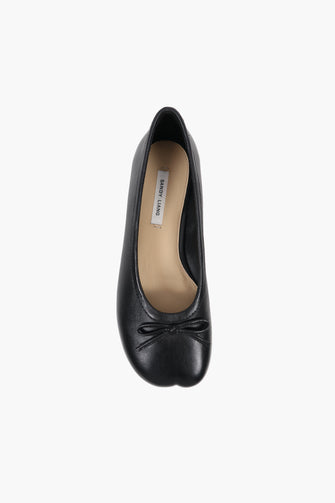 black leather ballerina flat product image on white background