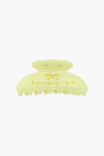 Yellow hair claw clip with yellow rhinestone details on a white background