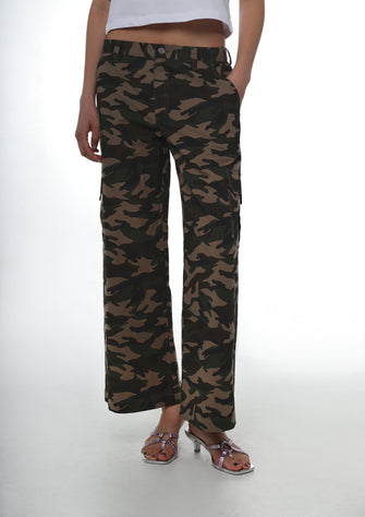 Camouflage pants worn by a person on a white background