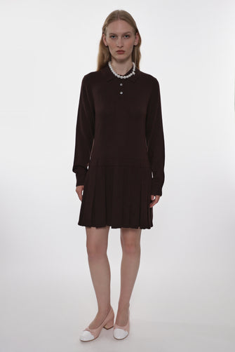 Woman wearing a brown dress with a white background