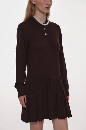 Model wearing a Brown knit dress on a white background
