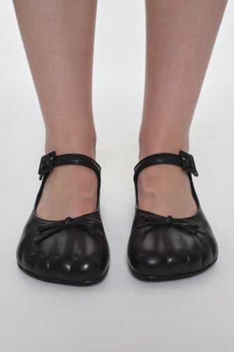 black leather mary jane shoes on model