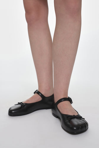 black leather mary jane shoes on model