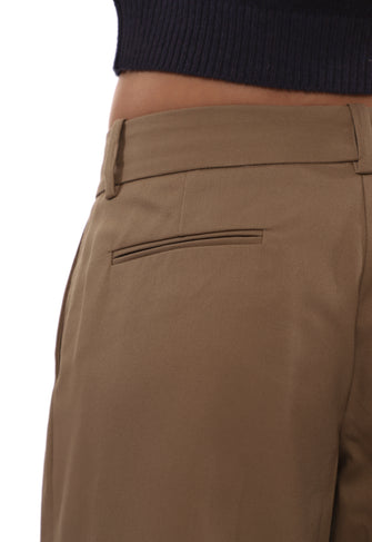 Close-up of brown pants with a black sweater at the top