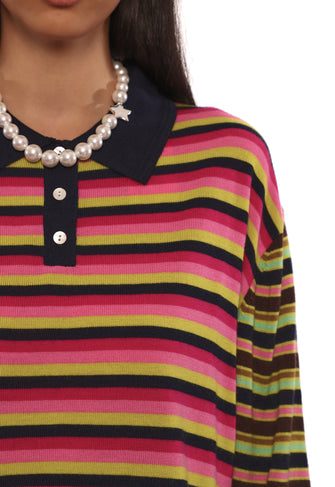 Multicolored striped shirt with a pearl necklace on a white background