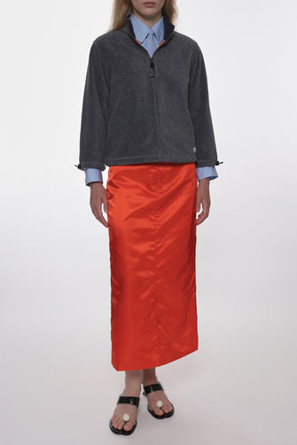 orange mid length nylon skirt on model