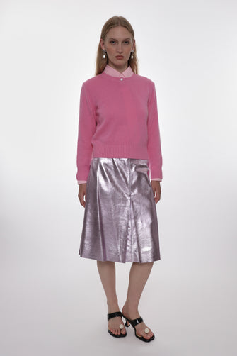 metallic pink mid length leather skirt on model