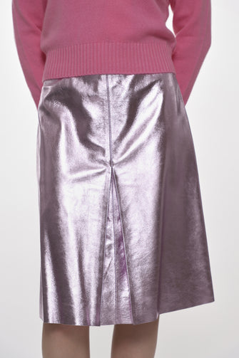 metallic pink mid length leather skirt on model