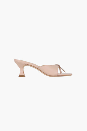 A side view of a pink leather thong mule with a padded footbed and a 60mm heel against a white background