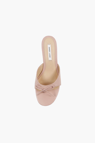 A top view of a pink leather thong mule with a padded footbed and a 60mm heel against a white background