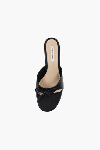 A top view of black nappa leather thong mule with a padded leather footbed and a 60mm heel against a white background