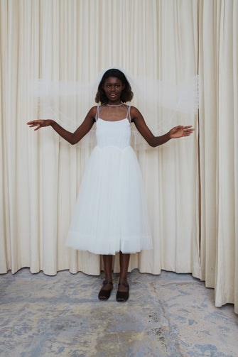 White veil with ruffles at hem on model