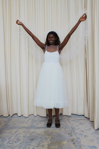 White veil with ruffles at hem on model