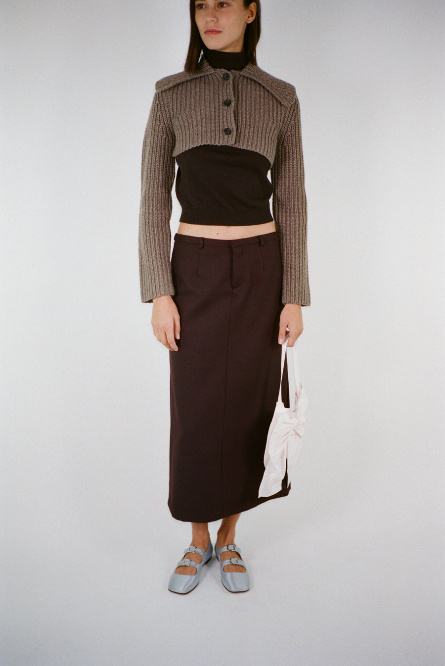 Midi length skirt in brunette brown suiting fabric on model