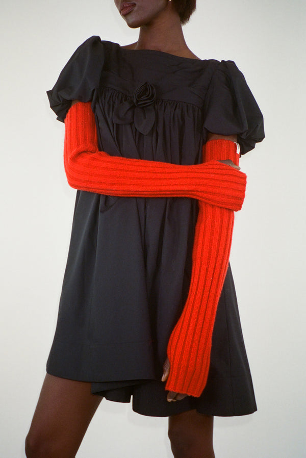 Knit arm warmers in flame red with thumbhole