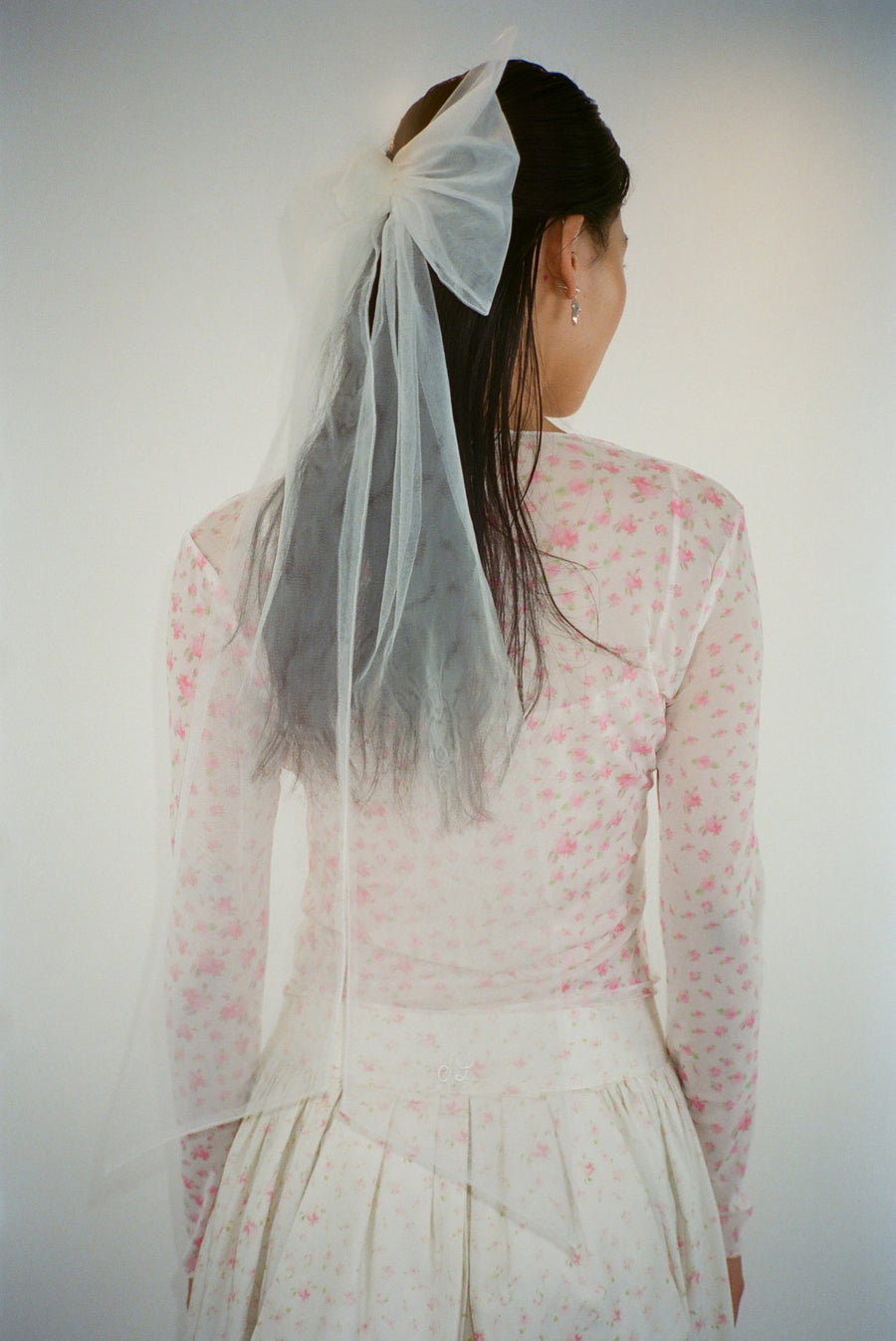Long white mesh hair bow on model