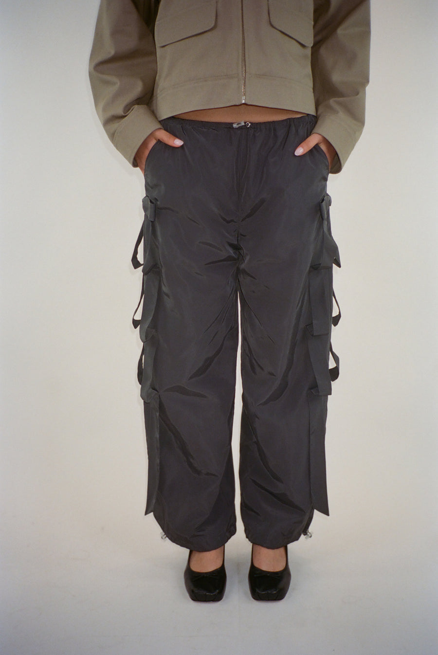 Trackpant in charcoal with tacked bow detail at sides on model