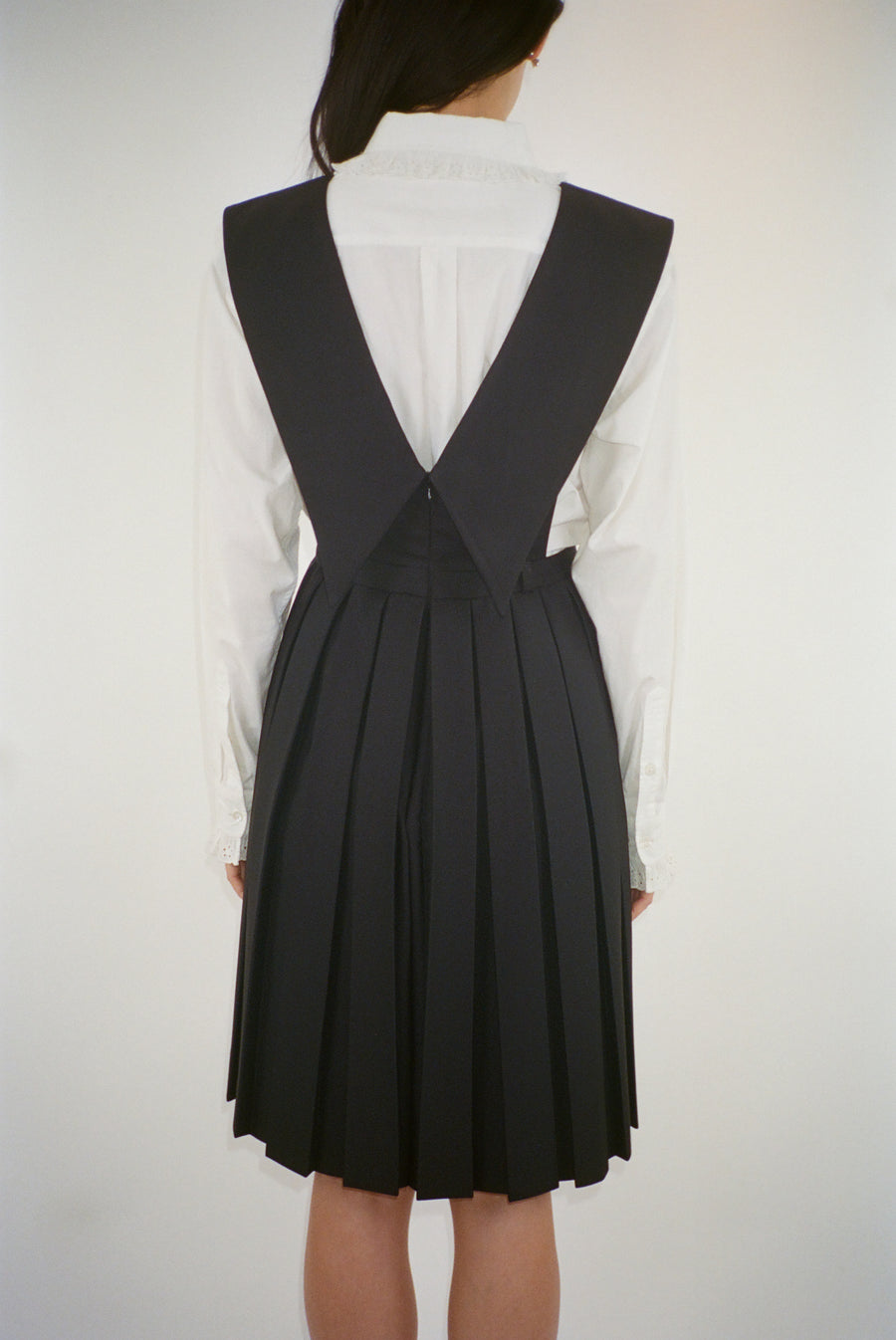 Knee length pinafore dress in black