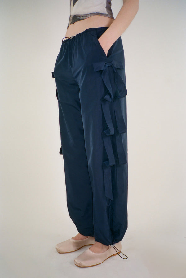 Trackpant in navy with tacked bow detail at sides