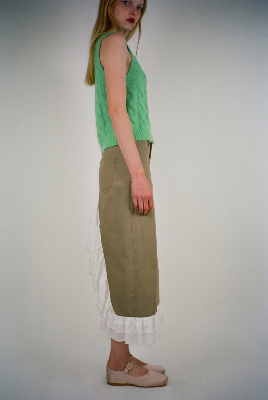 Midi skirt in taupe with eyelet ruffles on hem and back on model