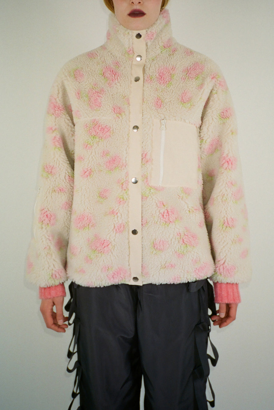 Fleece jacket in cream and pink floral print on model