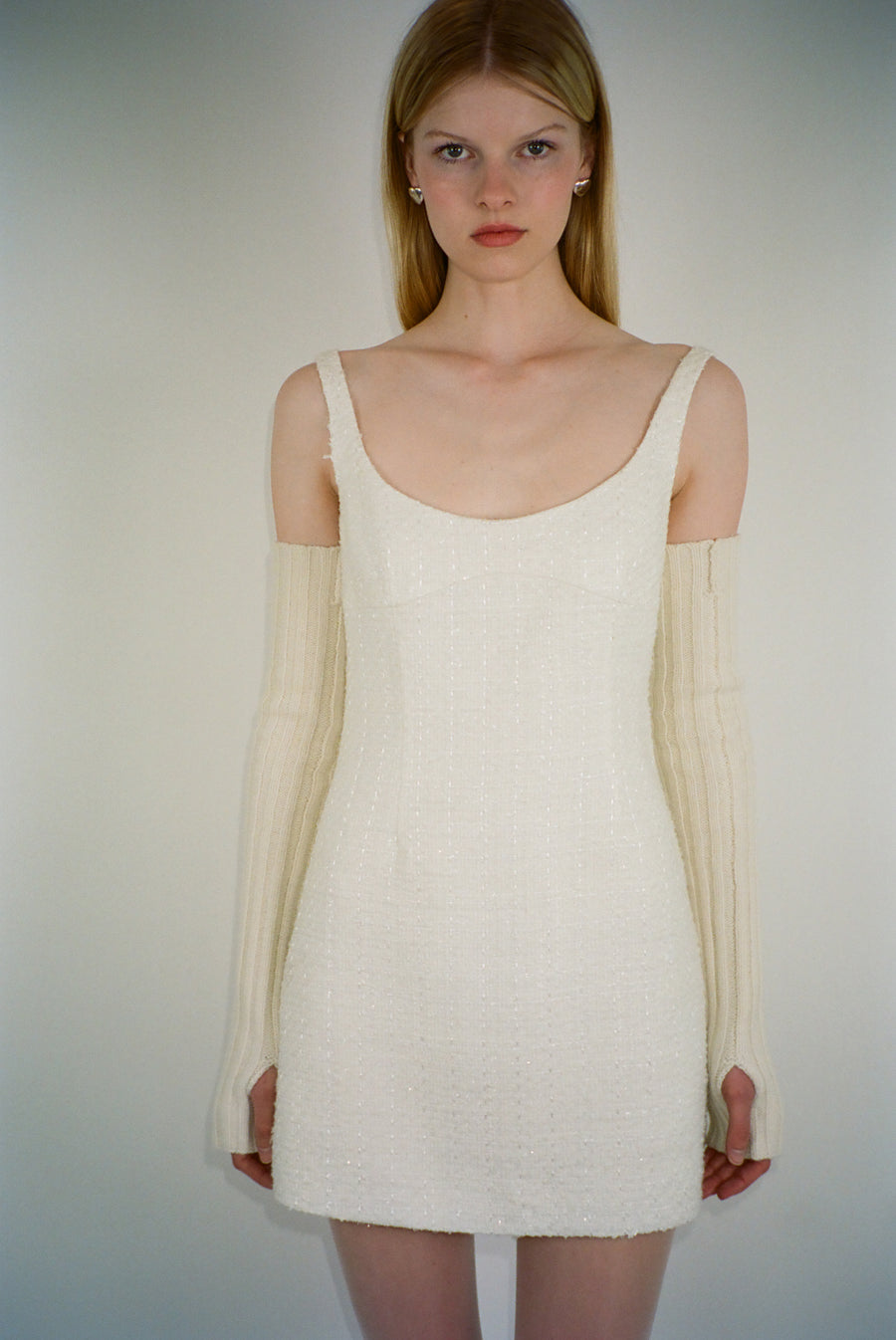 Sleeveless mini dress in off white tweed on model