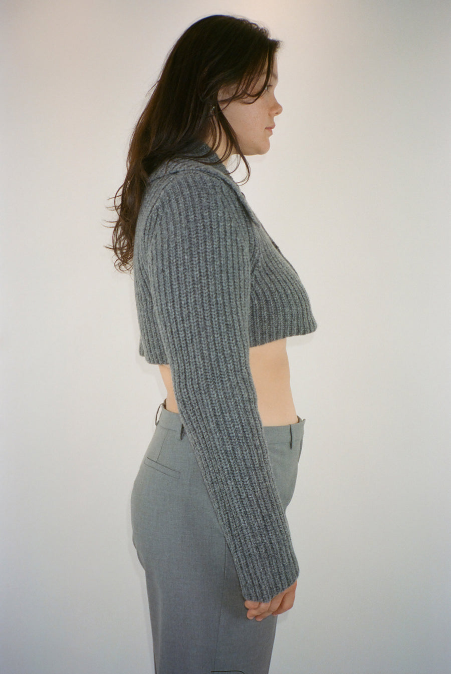 Cropped cardigan sweater in grey with button closure on model