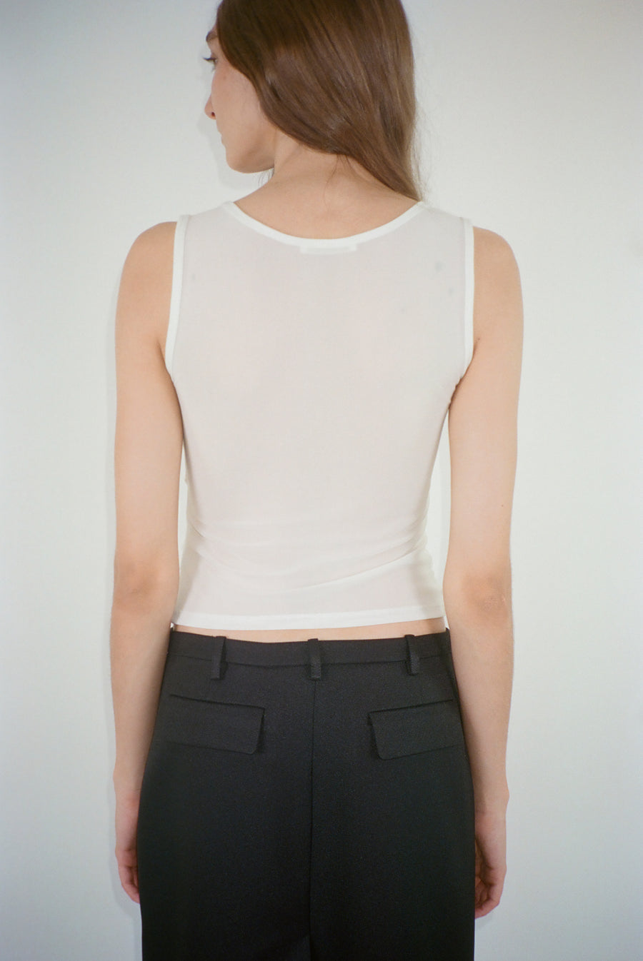 Mesh tank top in white with smocked jersey panel at front on model
