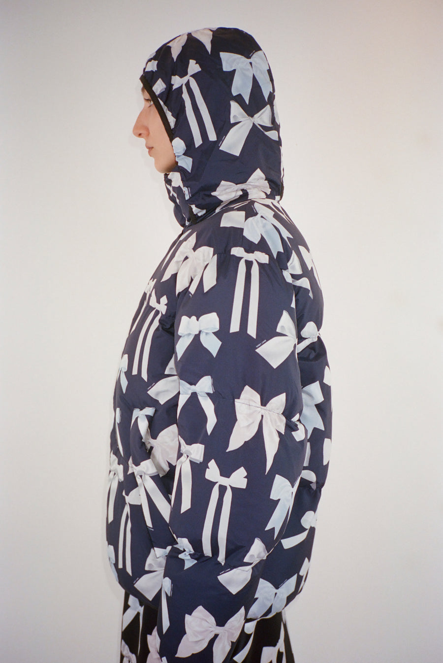 Puffer jacket in bow display print on model