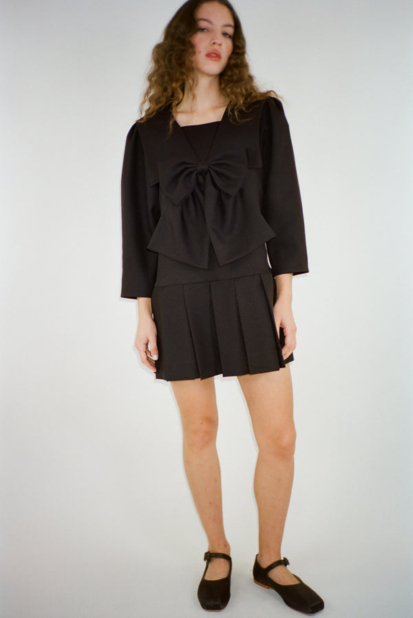 Mini dress with oversized bow at front in brown