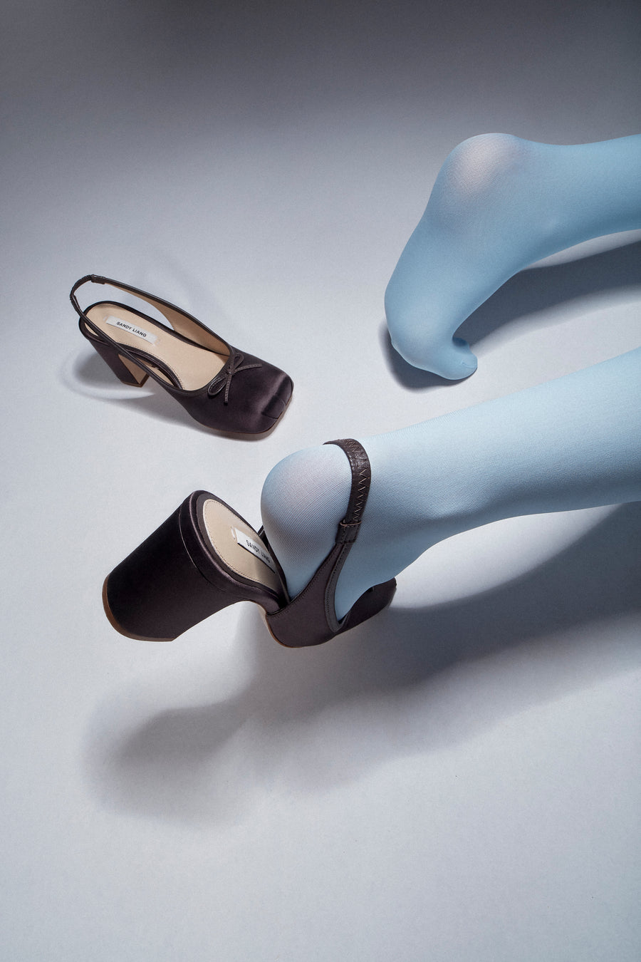 Slingback satin heels in brown on model