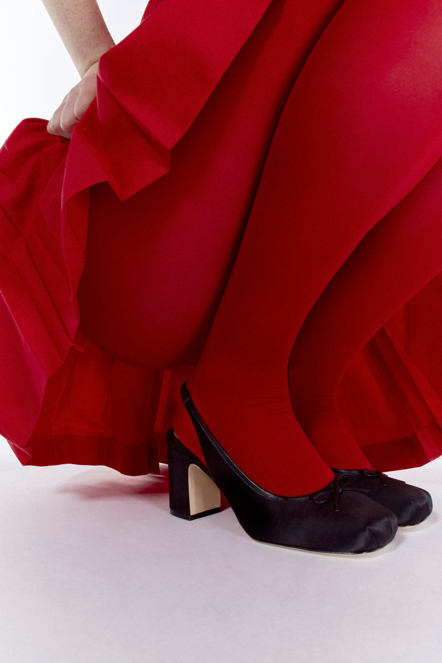 Slingback satin heels in black on model