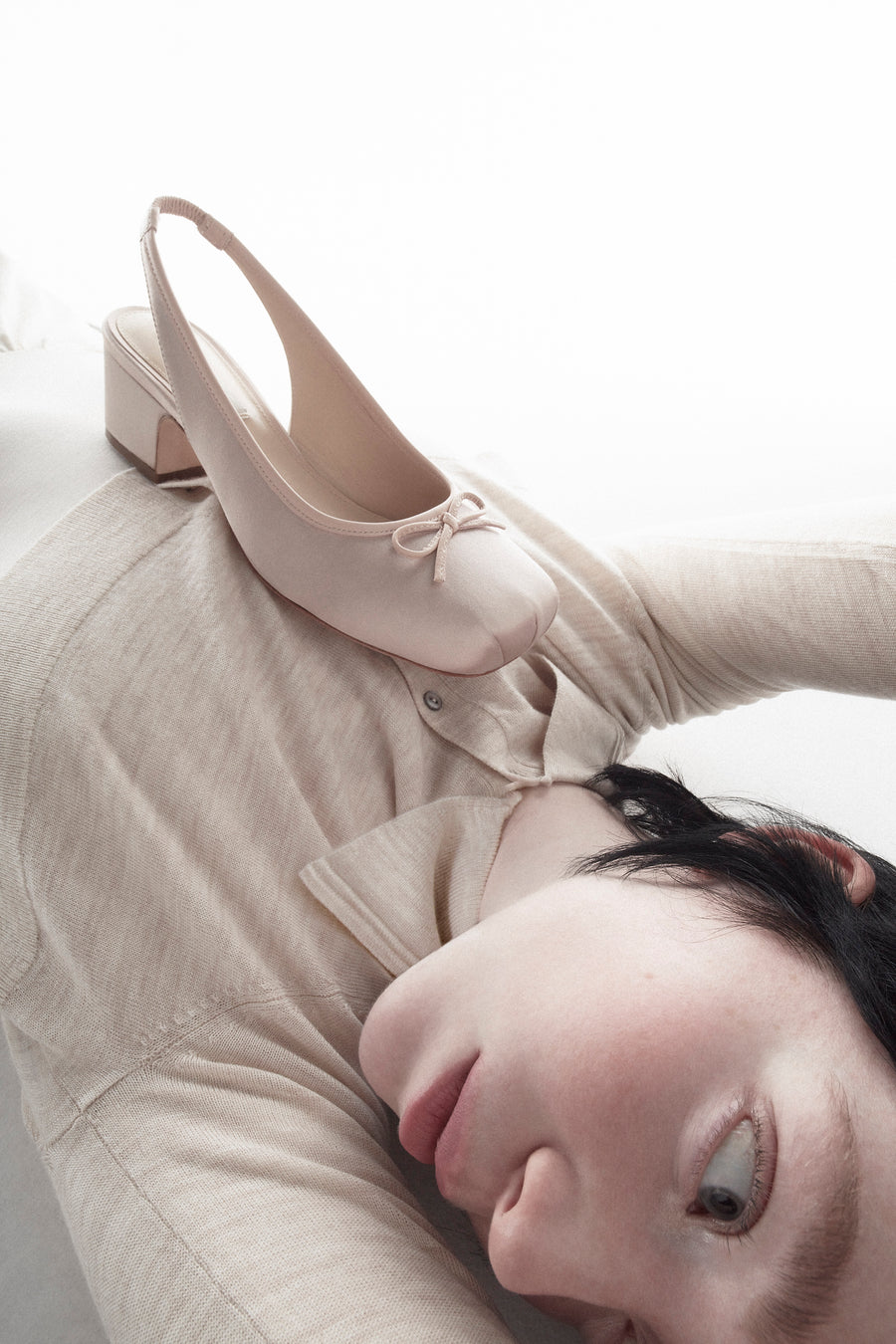 Slingback satin heels in ballet pink on model