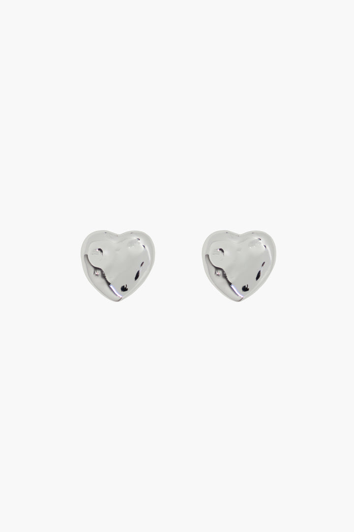 Sterling silver plated heart stud earrings on model