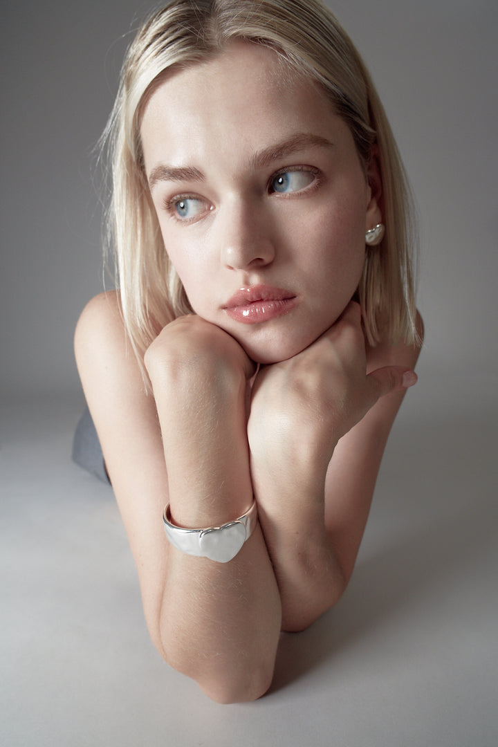 Sterling silver plated heart arm cuff on model