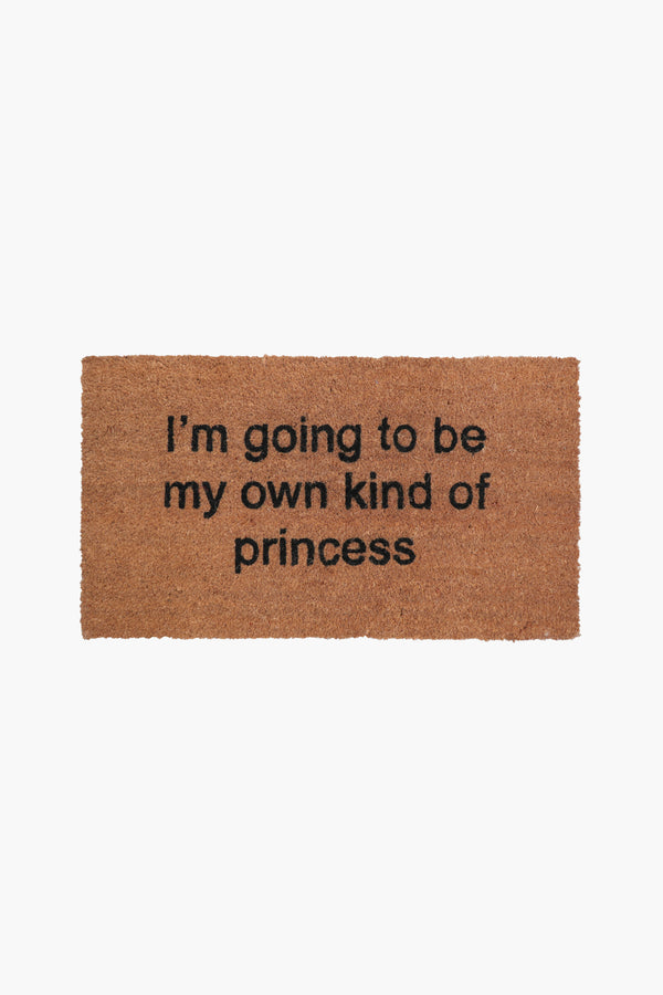 Brown door mat with graphic "i'm going to be my own kind of princess"