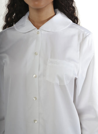 Close up of a white button down shirt with peter pan collar, Mother of Pearl buttons, and a pocket with logo embroidery at chest