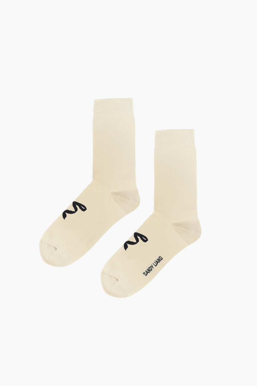 Butter yellow crew length socks with black bows on feet